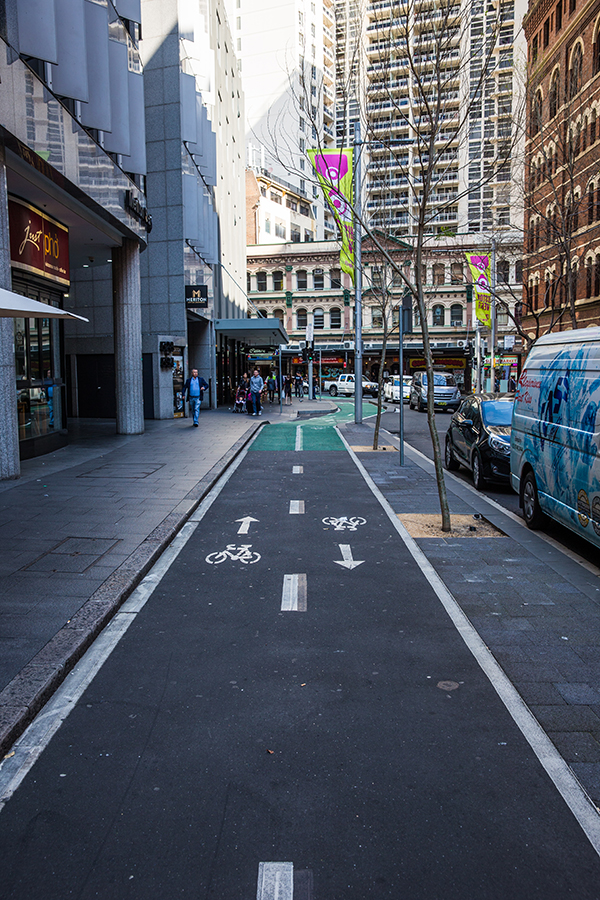 The new Kent Street dual-way cycleway approaching a bend in the road in Sydney CBD.