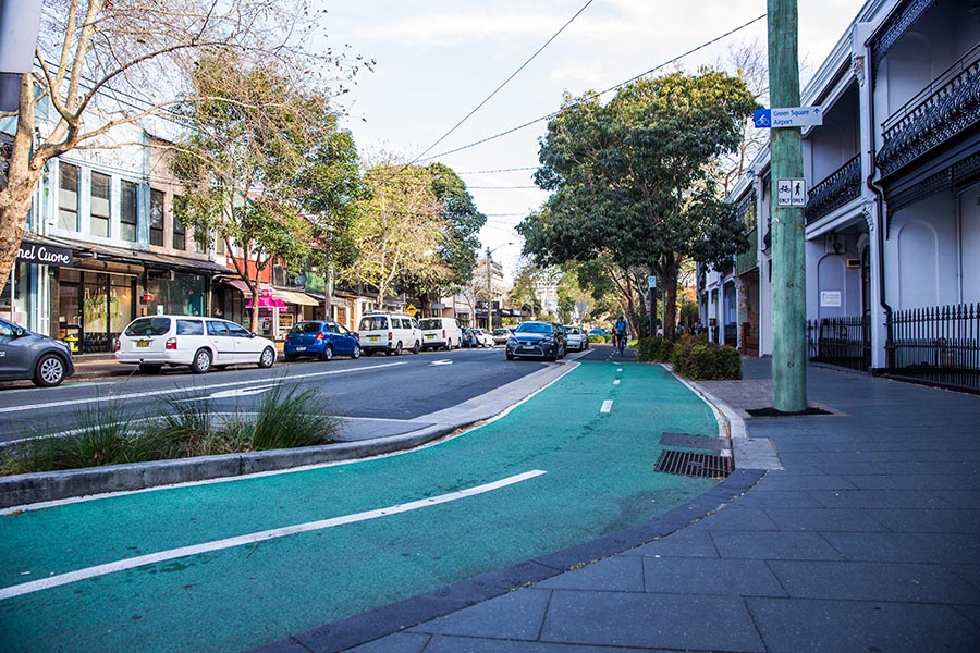 The new cycleway along Bourke Street, Surry Hills, follows the road whilst offering landscaping.